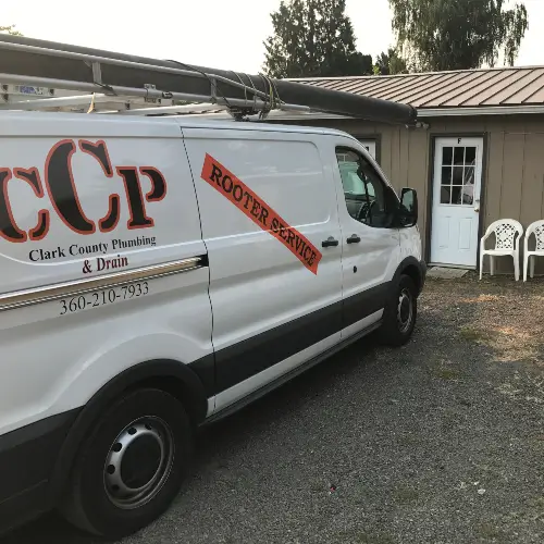 Clark County Plumbing service vehicle parked in front of their Camas office